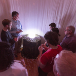 Audience members viewing dance in the crystal ball —
<a href="https://redesign.cathyweis.org/calendar/time-travel-with-madame-xenogamy" target="outside">April 3, 2016</a><br/>
Photo by Richard Termine